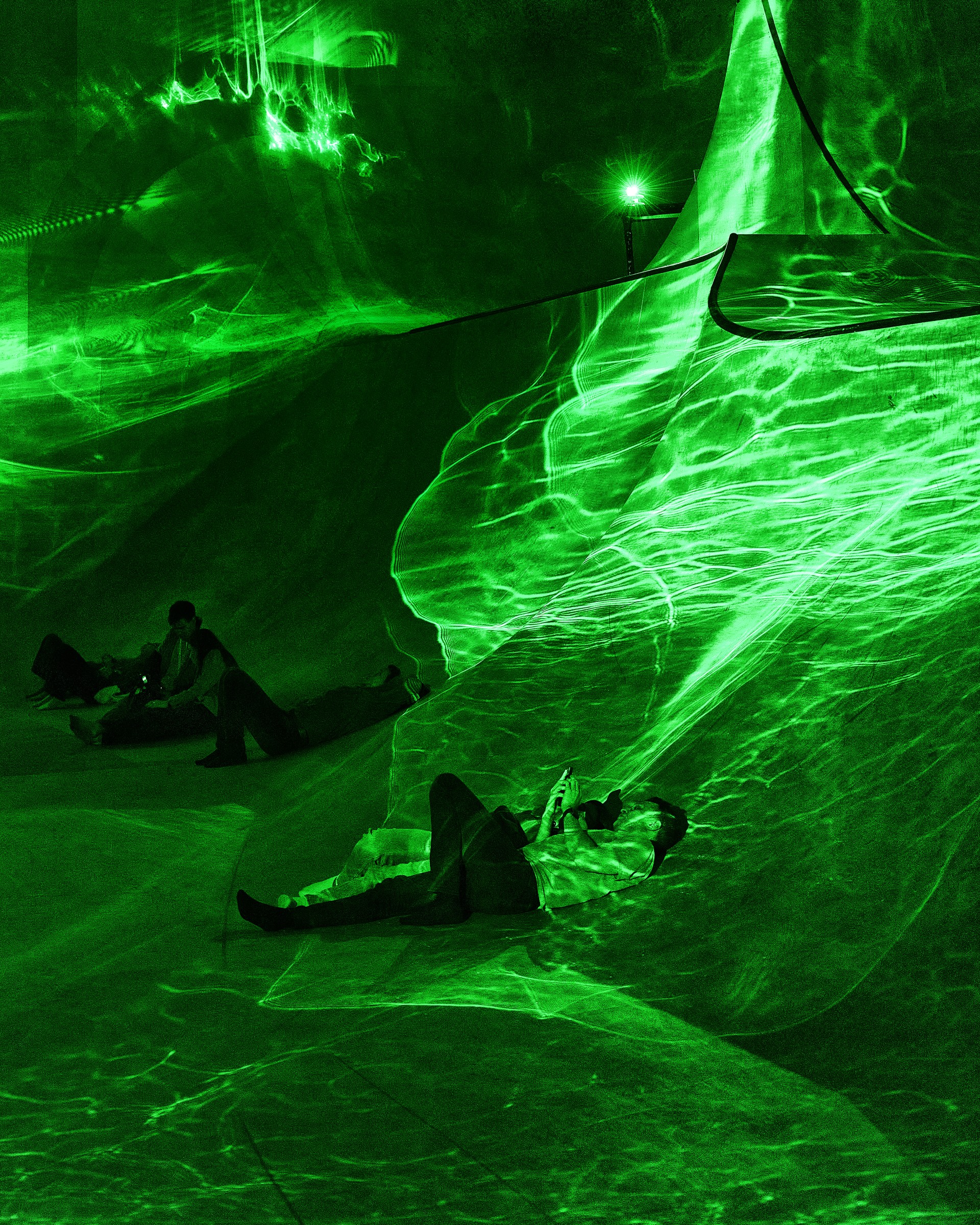 Refracted laser patterns moving across the landscape at Laser Meadows